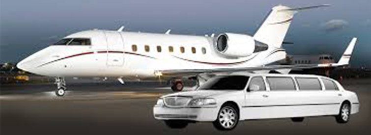 white limo next to airplane